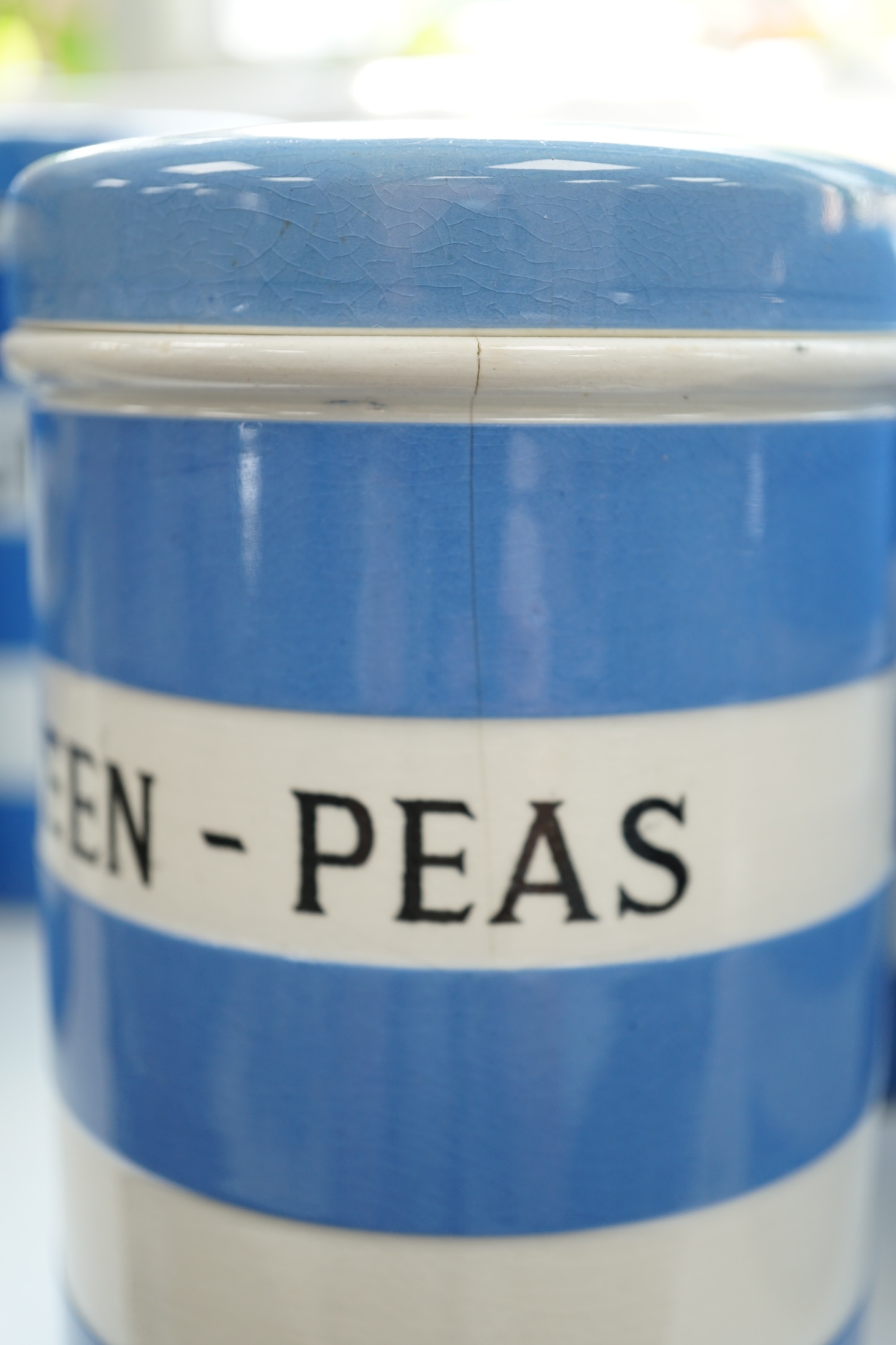 T.G.Green Cornish Kitchenware, ten 14cm lidded storage jars to include Green-Peas, Split- Peas, Cornflour, Ground Rice and Barley, mainly Black Shield marks. Condition - poor, fair and good